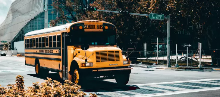 A school bus driving through a city